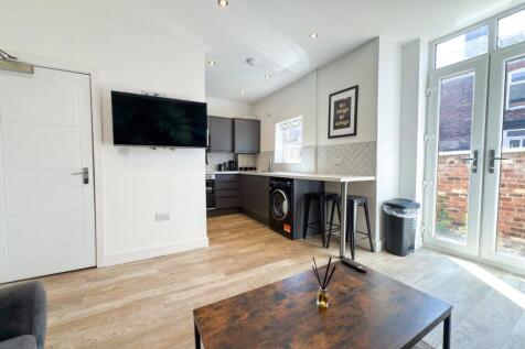 Bright modern open-plan living area with wooden...