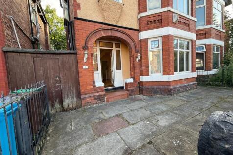 Red-brick period house with a covered entrance ...