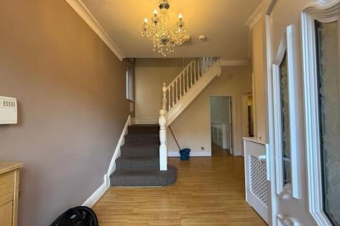 Bright, welcoming entrance hallway with a decor...