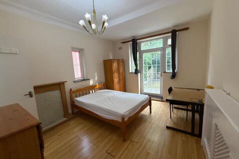 Bright, unfurnished double bedroom with timber ...