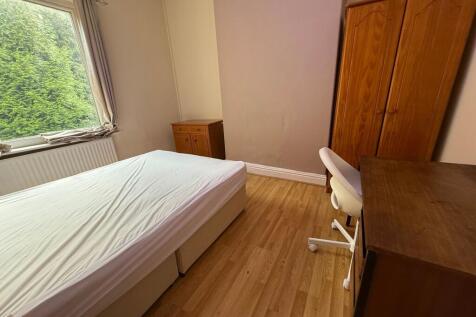 Bright, neatly presented bedroom with a double ...