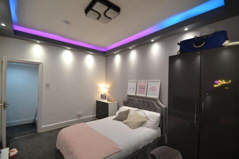 Bright, stylish bedroom with a comfortable doub...