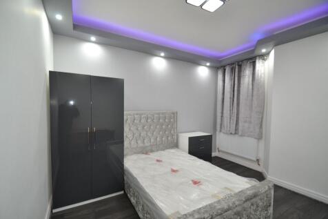 Modern single bedroom with a plush upholstered ...