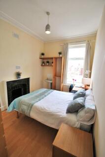 Bright, neatly presented bedroom with a comfort...