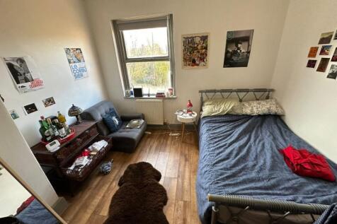 Bright, well-appointed bedroom with a double be...