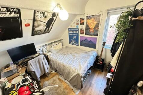 Cozy furnished bedroom with a double bed, study...