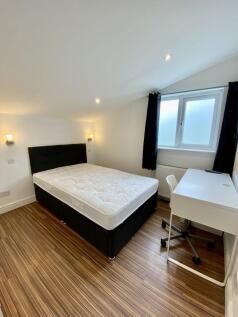 Bright, neatly presented bedroom with a double ...