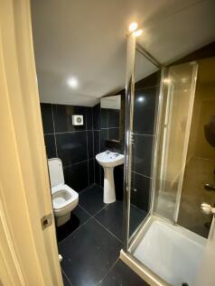 Modern tiled bathroom with a separate shower cu...