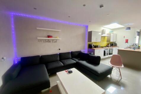 Contemporary open-plan living room with a large...