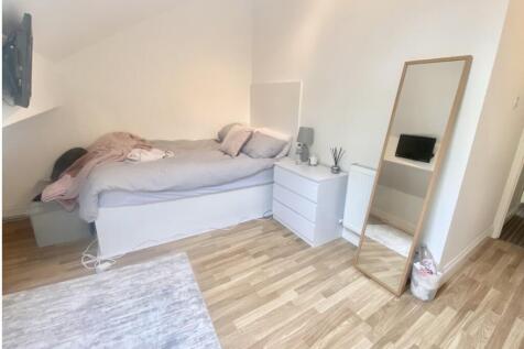 Bright, neatly presented bedroom with a comfort...