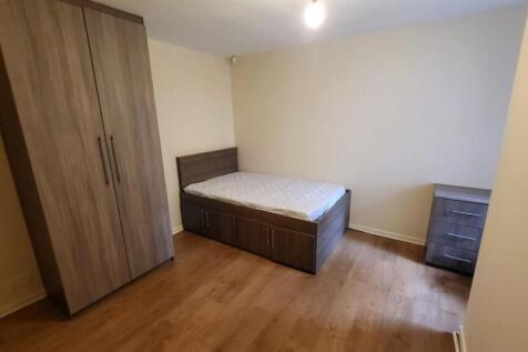 A bright and inviting double bedroom featuring ...