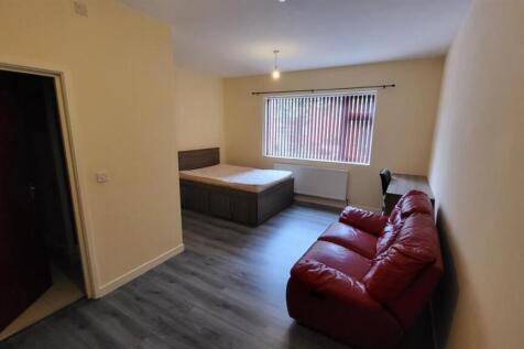 A bright and welcoming living room featuring a ...