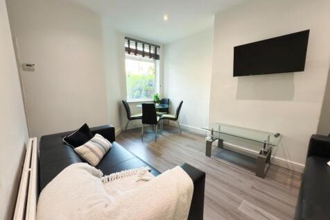 Bright, modern living room with comfortable sea...