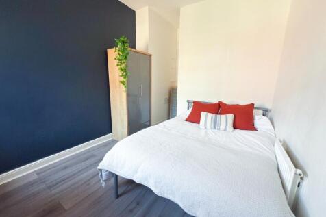 Bright, modern bedroom with a comfortable doubl...