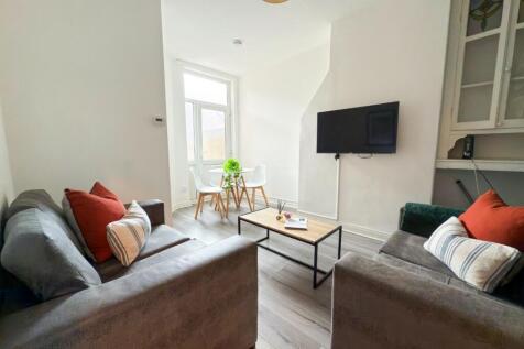 Bright, modern living room with two comfy sofas...