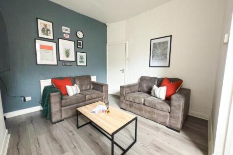 Bright, modern living room with two comfortable...