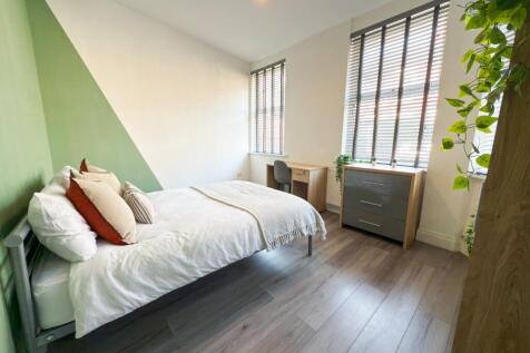 Bright, modern bedroom with a comfortable doubl...
