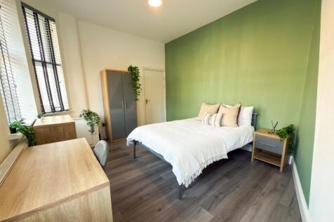 Bright, modern bedroom with a comfortable doubl...