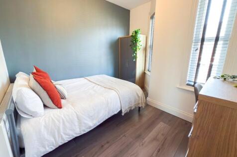 Bright, neatly presented bedroom with a double ...