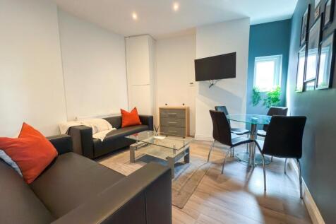 Bright, modern living room with comfortable sof...