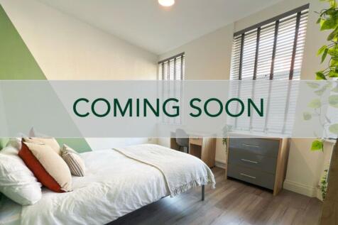 Bright, modern double bedroom with a comfortabl...