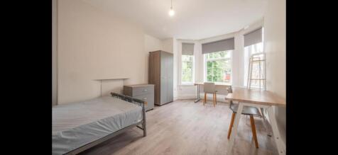 Bright, airy double bedroom with a large bay wi...