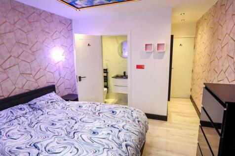 A stylish and inviting double bedroom featuring...