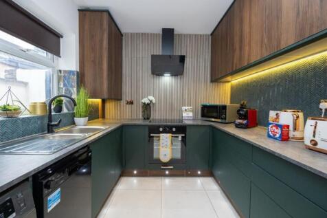 A modern and stylish kitchen with ample storage...