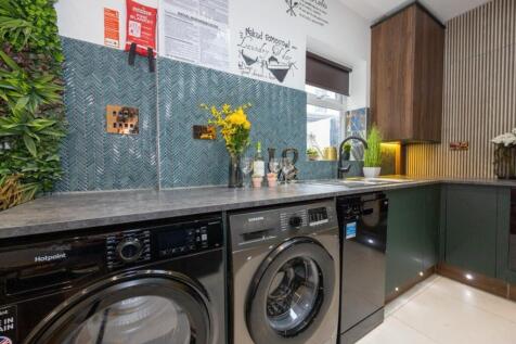 A modern and stylish kitchen featuring high-end...