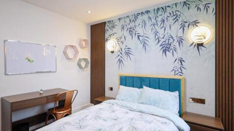 A stylish and inviting double bedroom featuring...