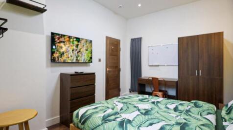 A stylish and inviting double bedroom featuring...