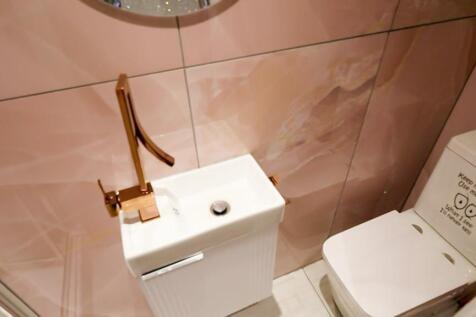 A stylish and modern single toilet with elegant...