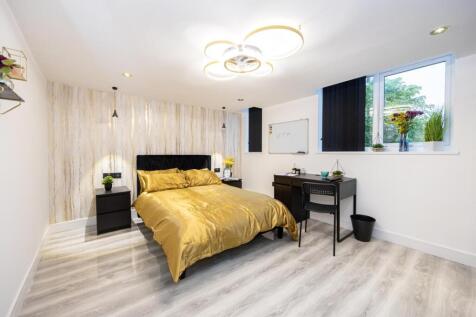 A stylish and spacious double bedroom featuring...