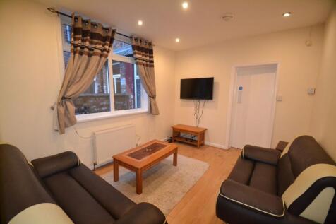 A bright and inviting living room featuring two...