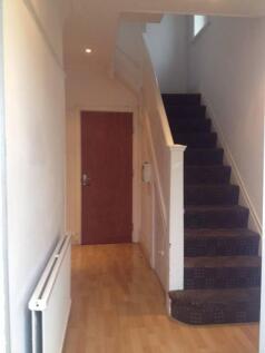 Bright entrance hallway with wood-effect floori...