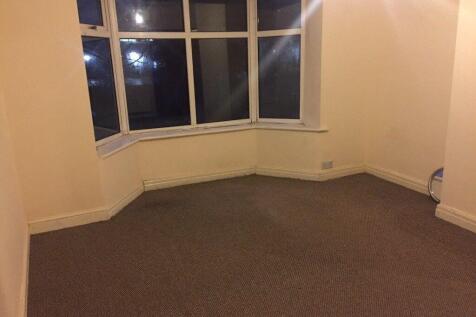 Bright bedroom with a wide bay window, neutral ...