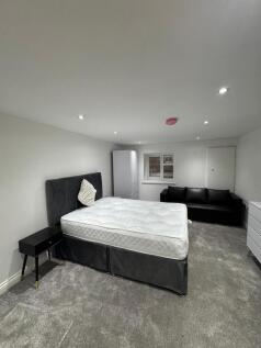 A modern double bedroom featuring a comfortable...