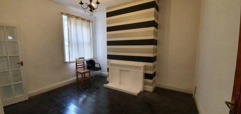 A contemporary living room featuring dark wood ...