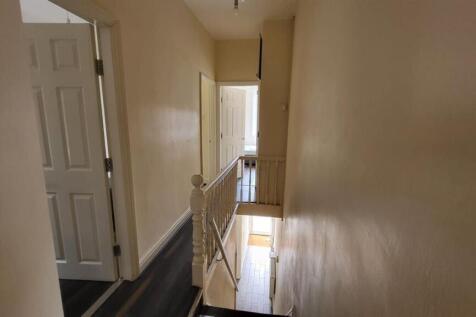 Bright first-floor landing with neutral walls, ...