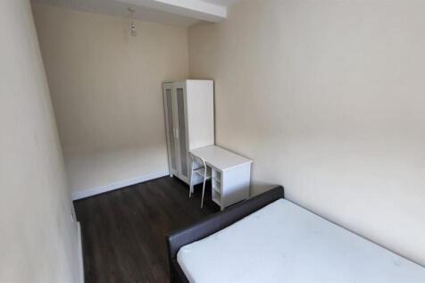 A small, clean bathroom with a visible toilet a...