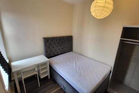 A simple, tidy bathroom with a basic WC and a c...