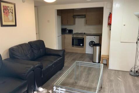 Bright, modern living area with comfortable lea...