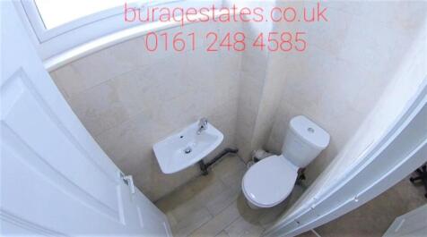 Compact and clean WC with a wall-mounted hand b...