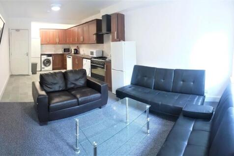 Bright, open-plan living space with modern seat...