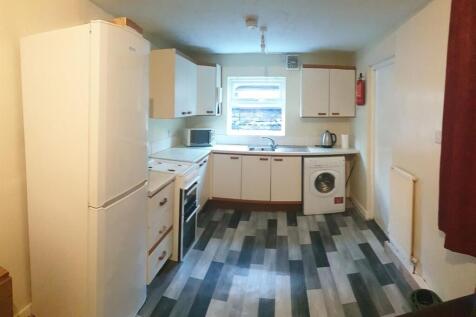 Bright, tidy kitchen with modern laminate floor...