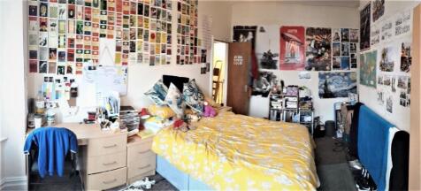 Bright, well-decorated single bedroom with a co...