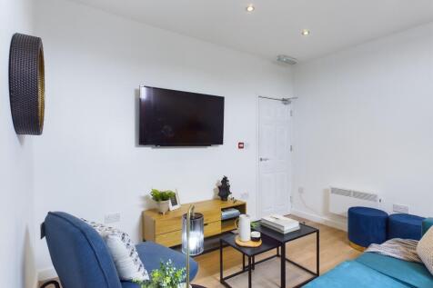 A spacious and stylish modern living room, perf...