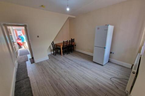A bright and spacious kitchen area featuring li...