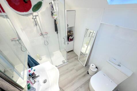Bright, modern bathroom with a walk-in shower, ...
