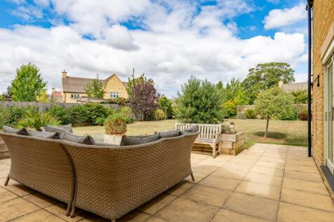 Folding doors from the kitchen onto an outdoor dining terrace